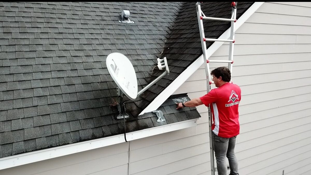 Homeowner meeting with licensed roofing contractor to review bid