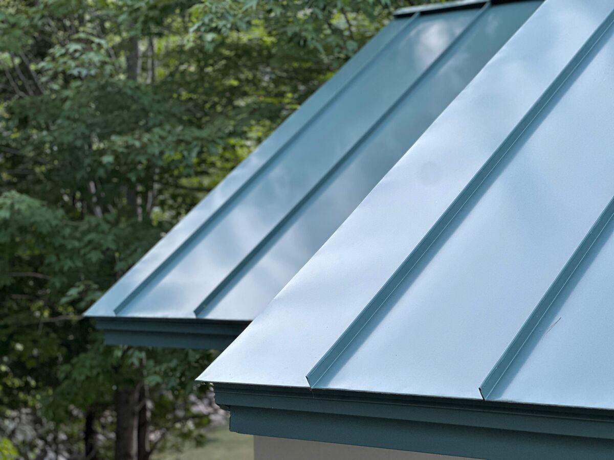 Standing seam metal roof panels with clean vertical seam lines